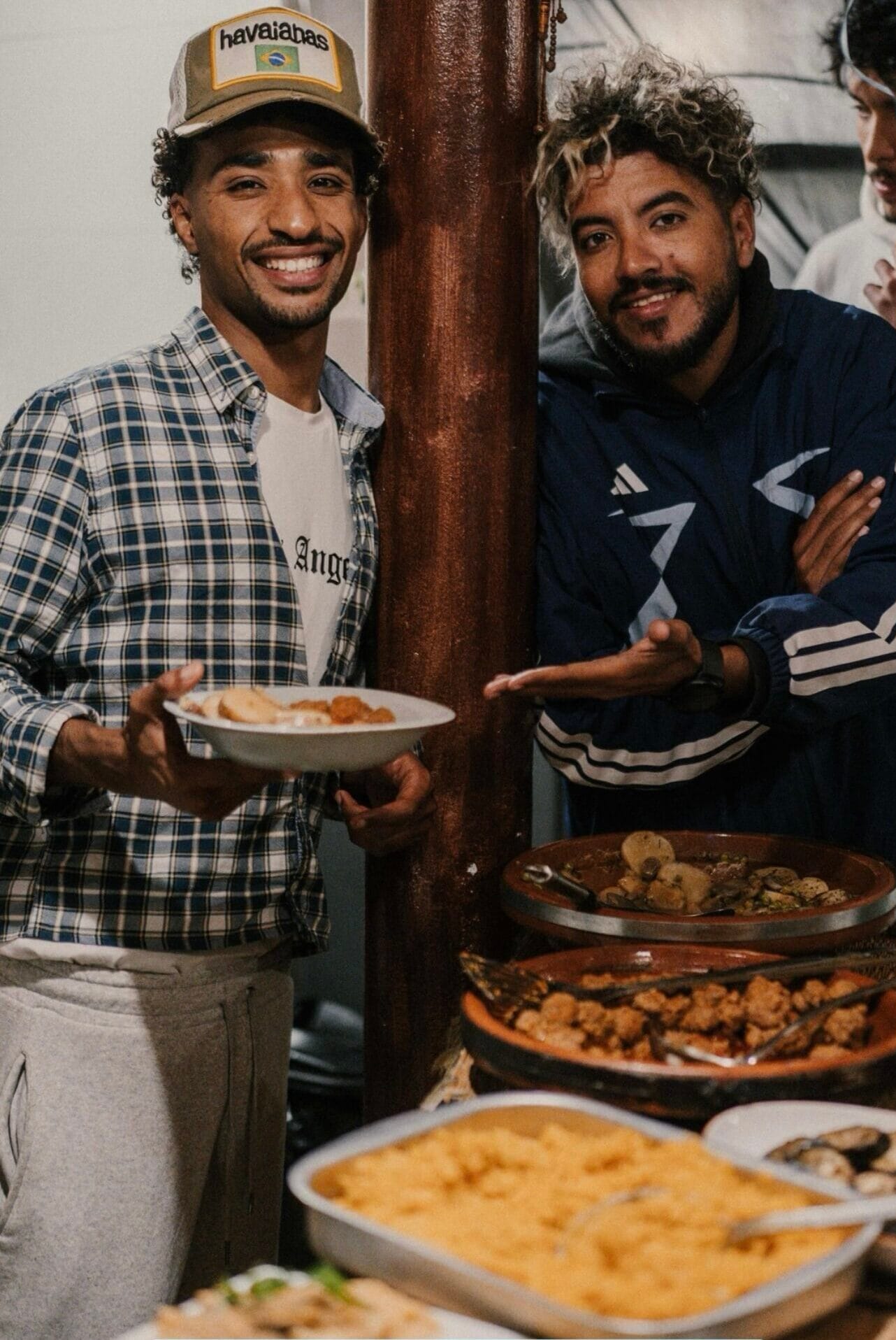 Ilyass, founder and head coach, serving dinner at the surf house