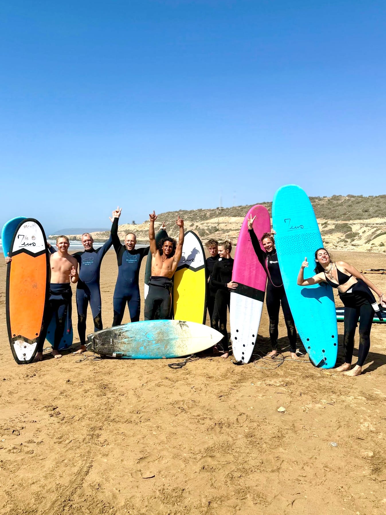 Colourful boards on the beach