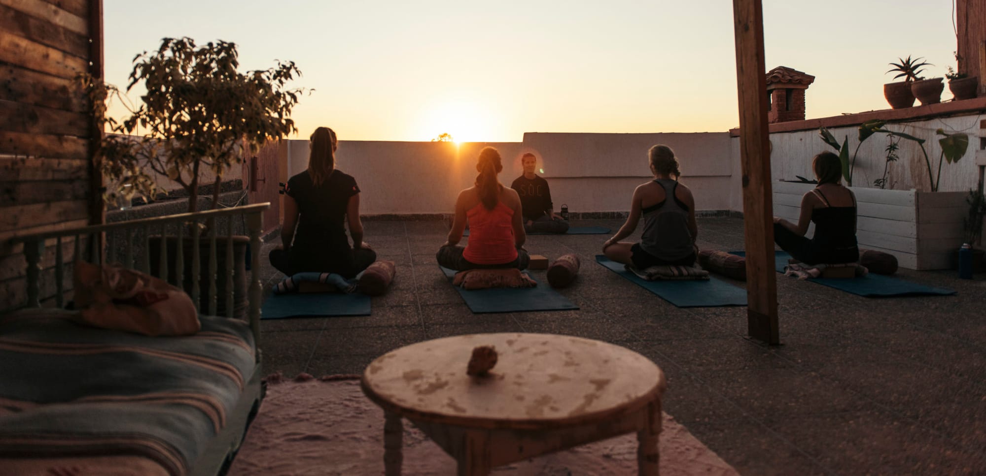 Rooftop yoga at sunset